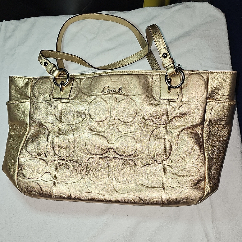 Coach Gold Shoulder Bag with Embossed Pattern and Luxurious Material